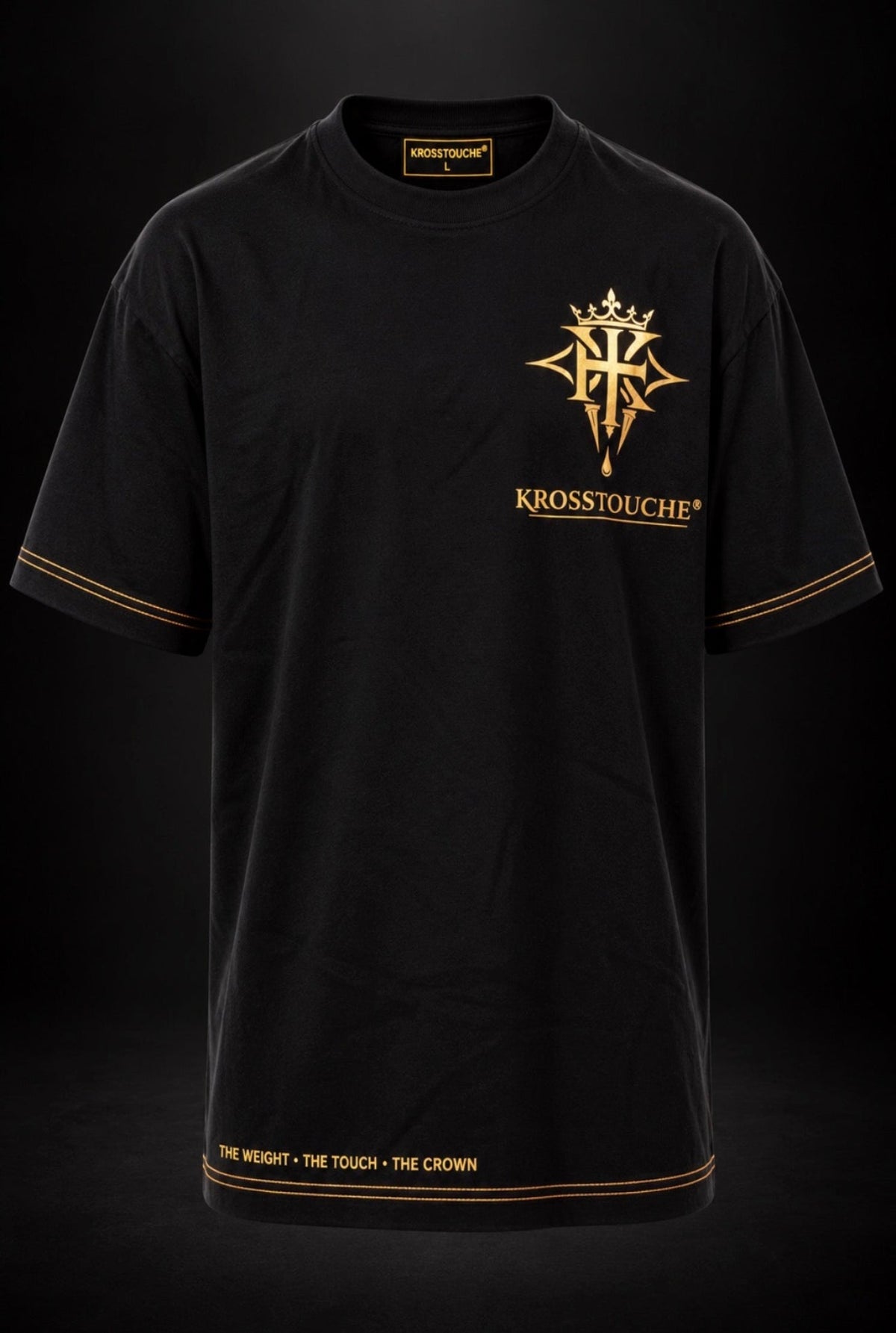 Black KROSSTOUCHE® luxury oversized T-shirt featuring a gold crown and cross emblem, original gold KROSSTOUCHE® chest logo, gold double-stitch sleeve and hem detailing, and the signature philosophy, The Weight • The Touch • The Crown.