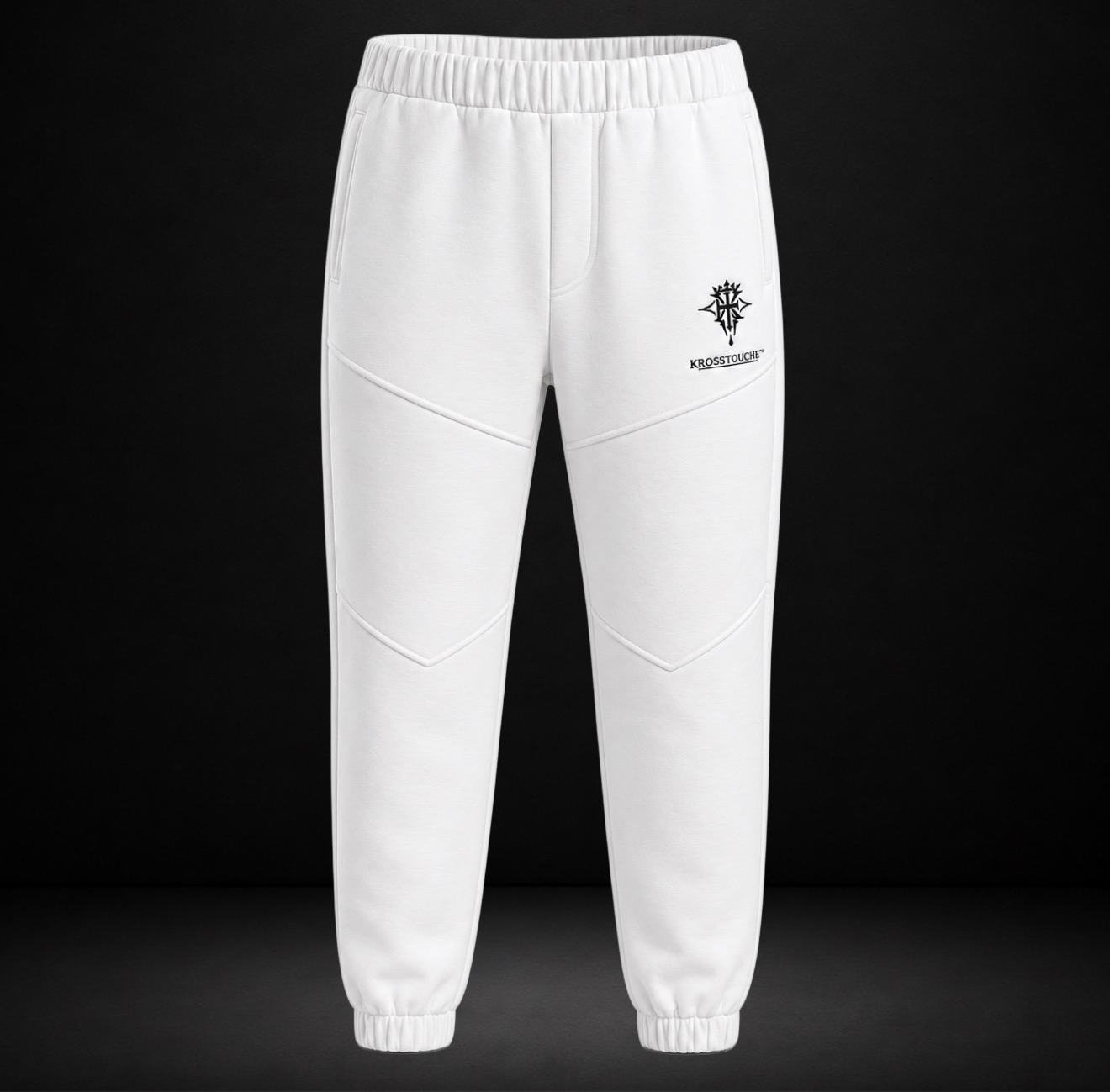 Front view of the KROSSTOUCHE® Signature Crest Panelled Joggers in Optic White with black crest logo, wordmark and sculpted leg panelling.