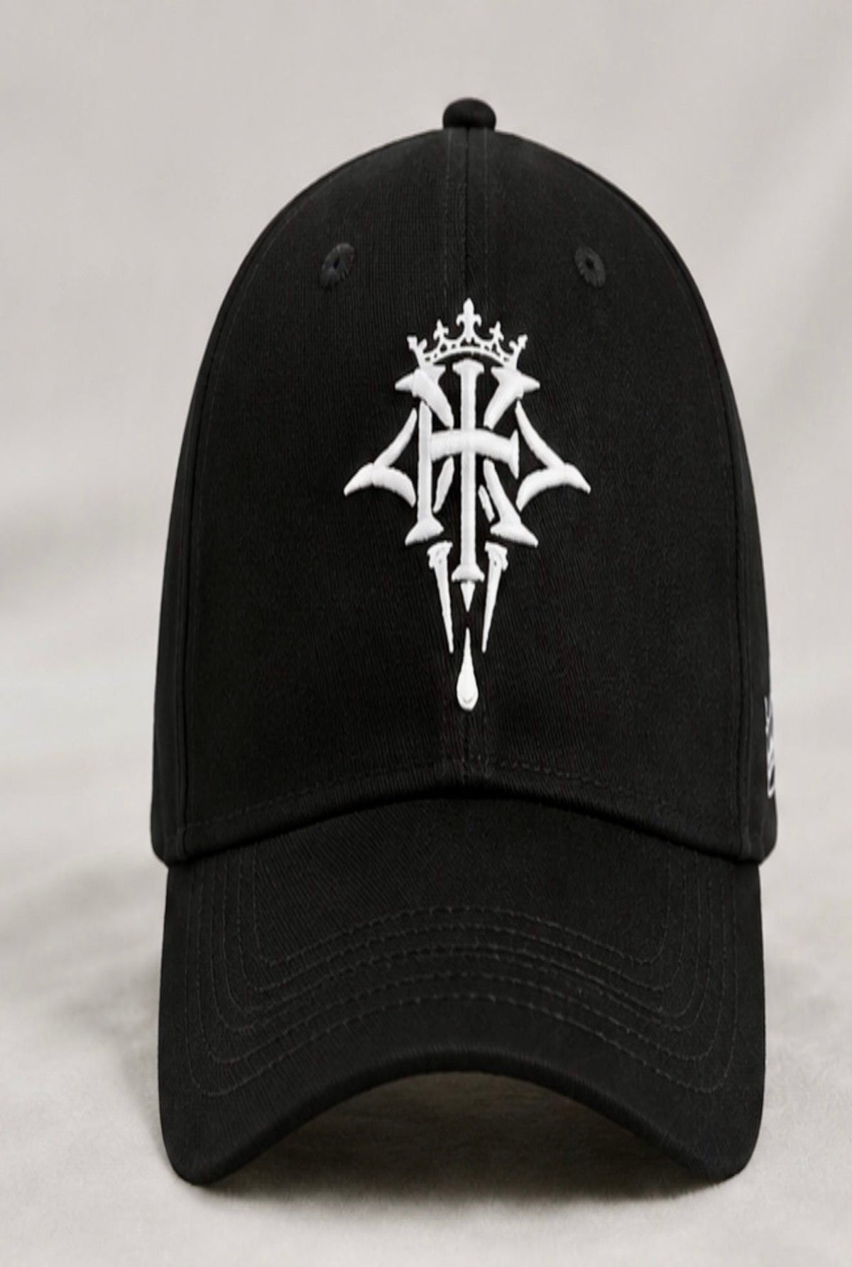 Front view of the KROSSTOUCHE® Signature Embroidered Baseball Cap in black with premium white embroidered crest.