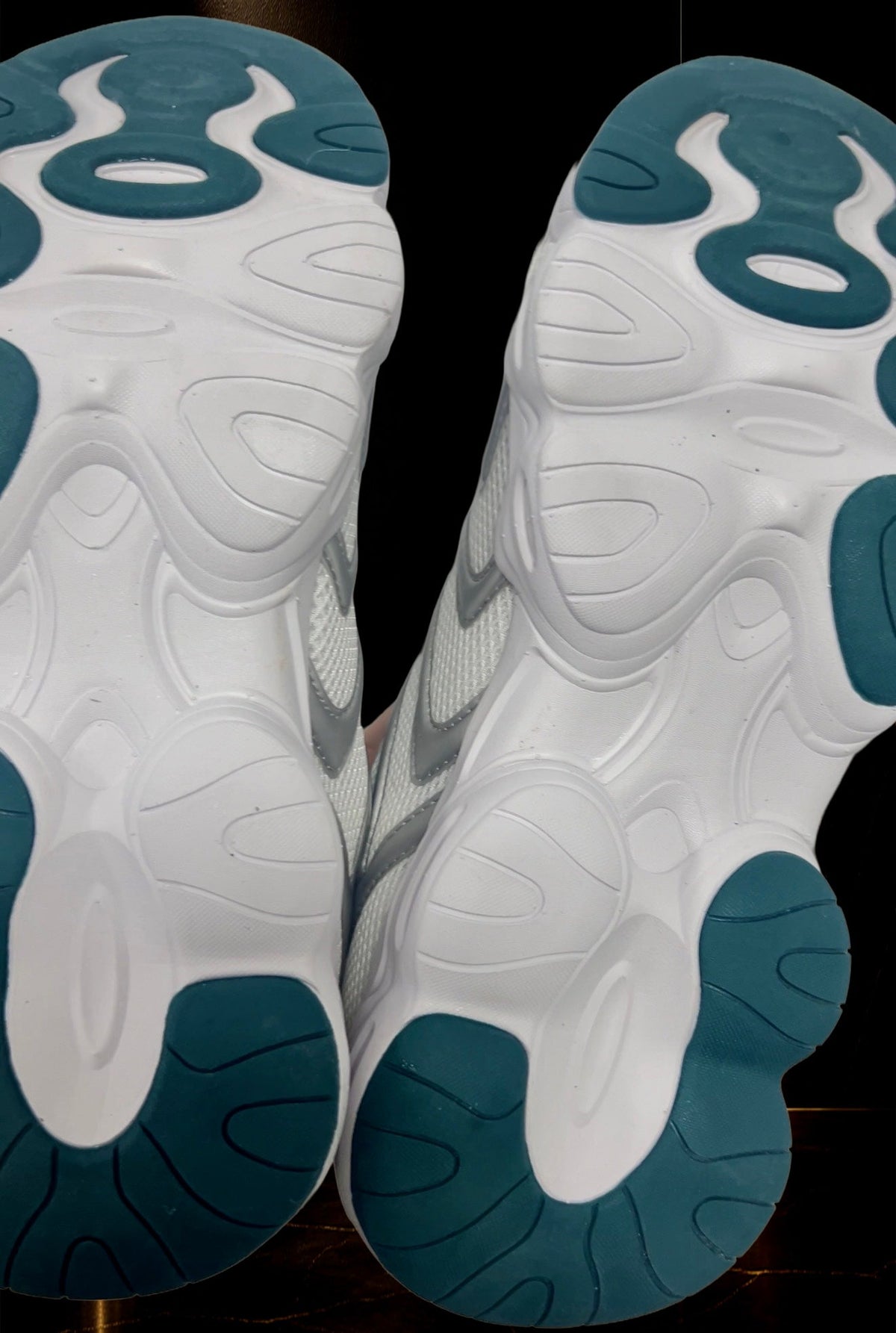 KROSSTOUCHE® CROWN RUNNER 01 luxury sneaker outsole in white and deep emerald green, showing the sculpted sole pattern and traction design