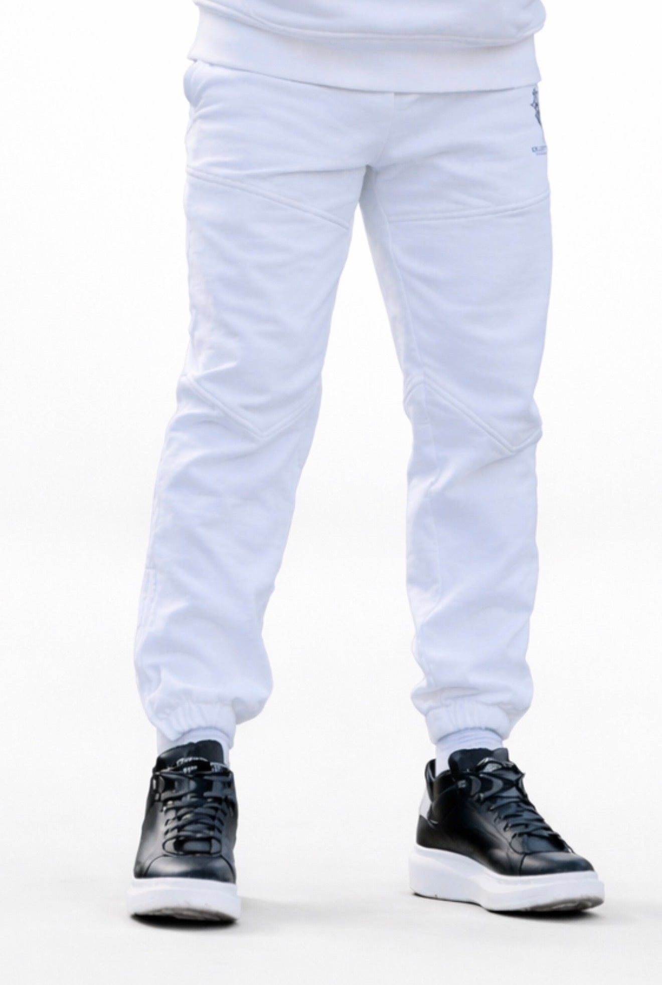 Optic white KROSSTOUCHE® joggers styled on body with black trainers in a clean  presentation.