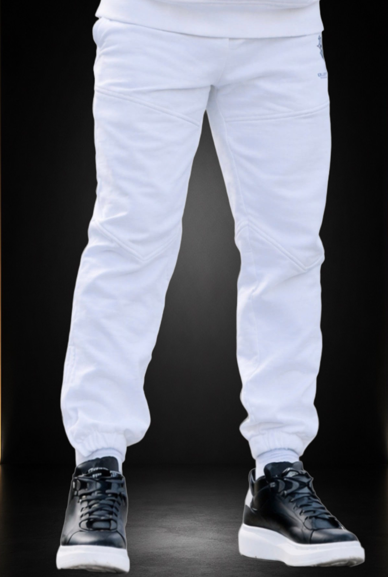 Optic white KROSSTOUCHE® joggers styled on body with black trainers in a clean presentation.