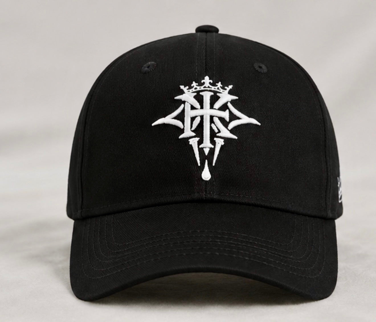 Front view of the KROSSTOUCHE® Signature Embroidered Baseball Cap in black with premium white embroidered crest.